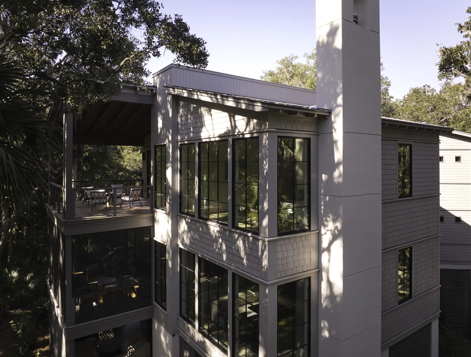 Modern home exterior with large black-framed windows