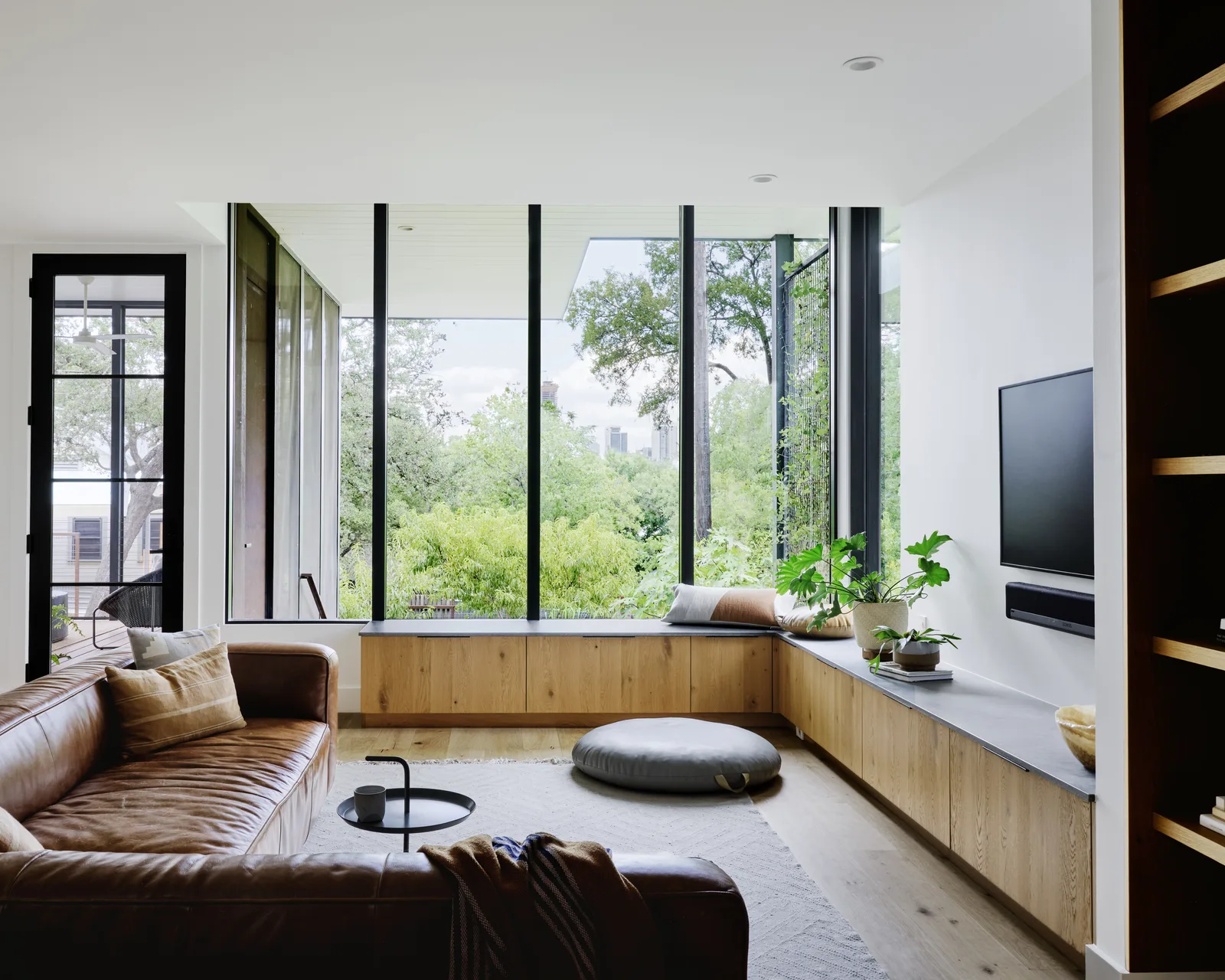 Bright living room with a wide wall of replacement windows